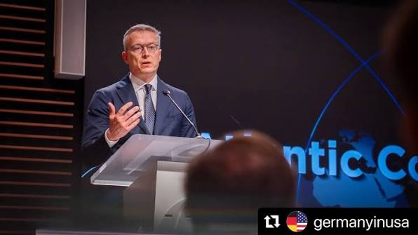Karsten Wildberger speaking at a lectern in front of an Atlantic Council screen